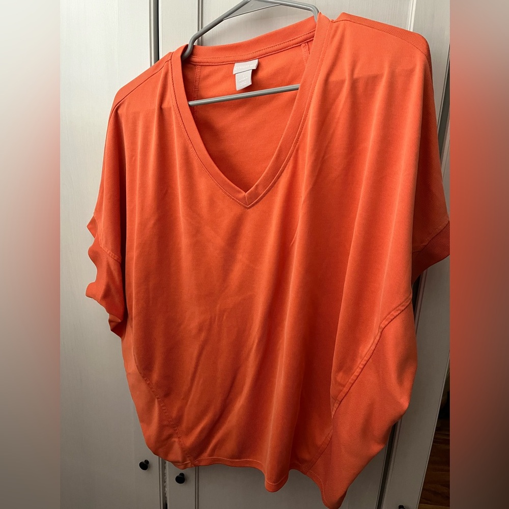 Chico’s Woman’s short sleeve top. Orange, size M